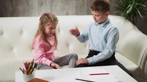 Children Playing Hand Slapping Game at Table