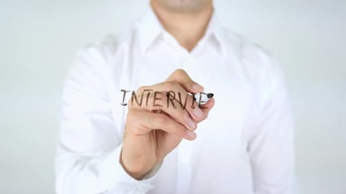Writing the Word Interview on a Clear Surface
