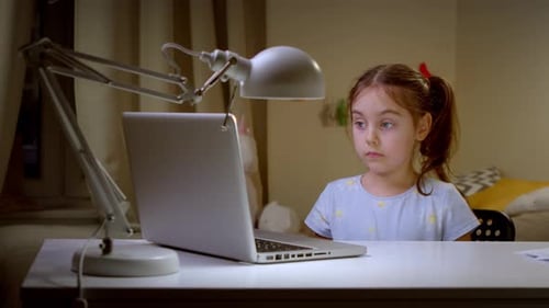 Girl at Desk with Laptop Computer