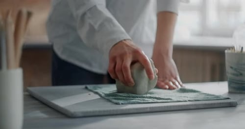 Ceramist Kneads a Piece of Clay to Make Pottery at the Workshop Potter at Work Craftsmanship of