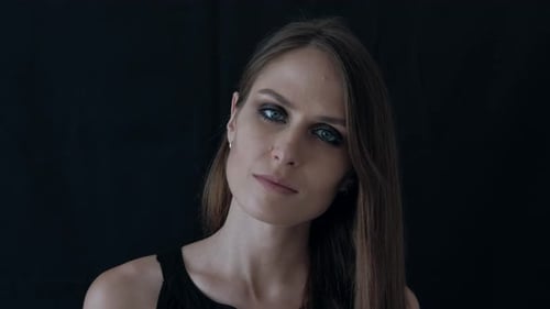 Portrait of a Beautiful Woman on a Black Background