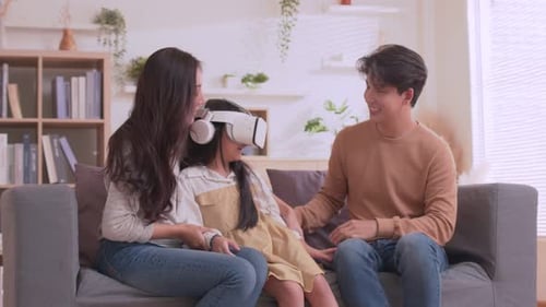 Family Fun Experiencing Virtual Reality Headset at Home