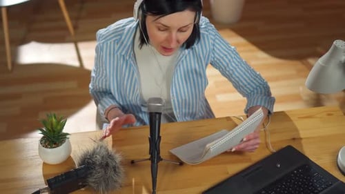 Woman Records a Podcast While Sitting in Her Living Roomtop View