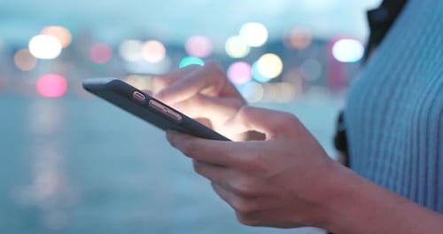 Close up of using smart phone at night