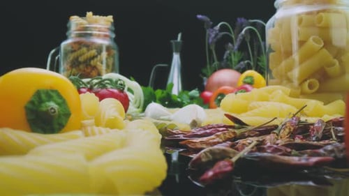 Uncooked dried pasta and fresh vegetables