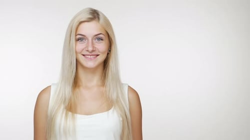 Smiling Woman Makes Ok Hand Gesture