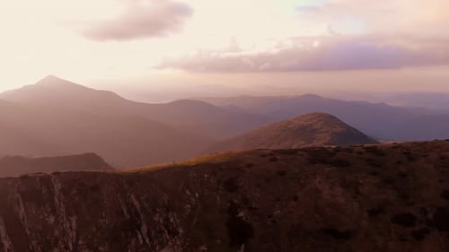 Mountain Ranges Under Sunset Sky