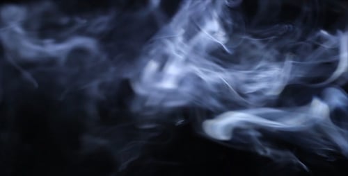 Abstract Blue Smoke Swirling on Black Background