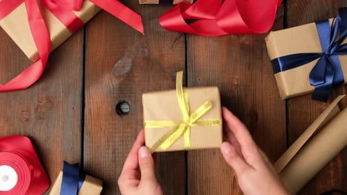 Festive Gift with Wrapping Paper on Wooden Table