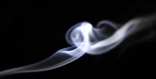 Abstract White Smoke Drifting on Black Background