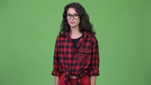 Young Woman Smiling and Giving Thumbs Up