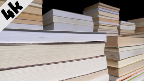 Stacks of Beige and White Hardcover Books