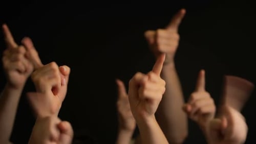 Group of Hands Pointing Upward on Black