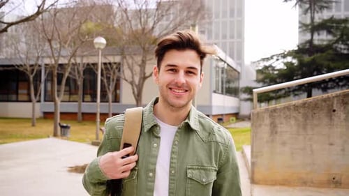 Close Up Shot of Cheerful Happy Caucasian Teenage Boy Looking at Camera Smiling