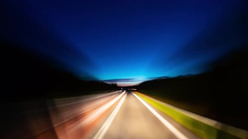 By car on a rural road at night, time-lapse