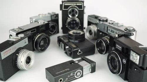 Collection of Vintage Film Cameras on White Background