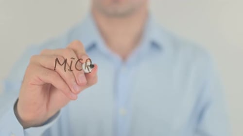 Hand Writes Micro Credit System on Glass