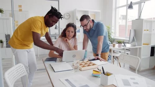 Diverse Colleagues Collaborating in Bright Modern Office
