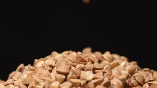 Buckwheat Grains Falling in a Heap Close Up
