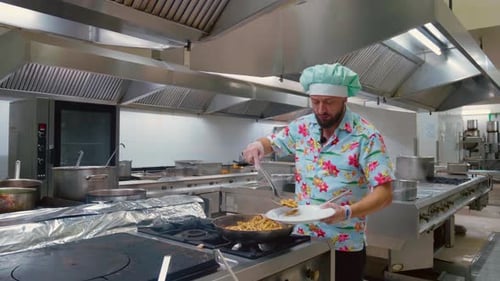 Chef cooks dish in the pan, restaurant kitchen.