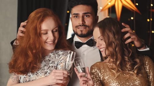 Three Friends Smile at a Birthday Party
