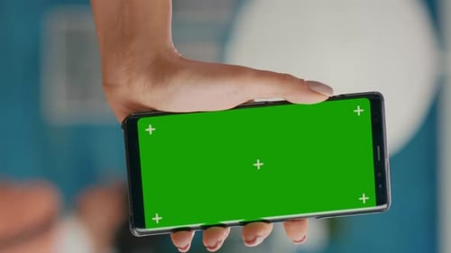 Vertical Video Hands of Freelencer Holding Vertical Mock Up Green Screen Chroma Key Smartphone