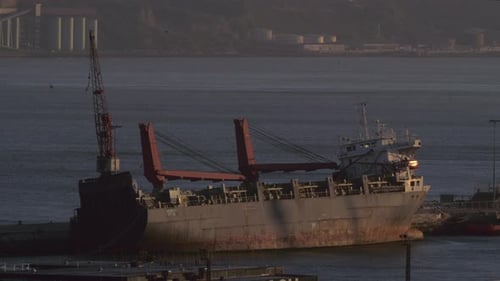 A Peaceful Landscape with an Abandoned Barge at the Pier