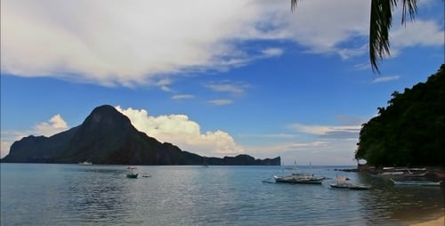 Cloudy Beach And Mountains