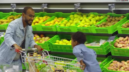 Father and Son Having Fun at Shopping