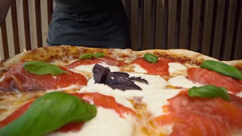 Chef Cuts Freshly Made Pizza with Round Cutter
