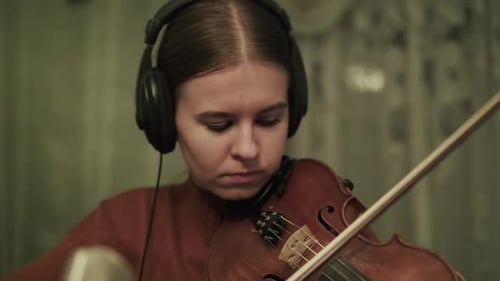 Young Adult Playing Violin in Home Studio