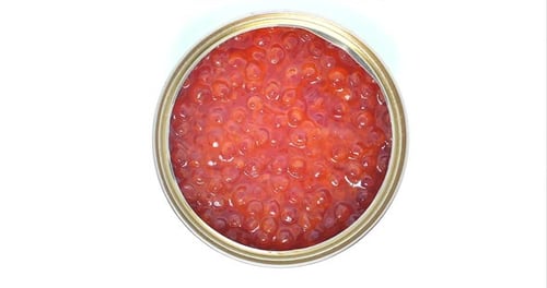An Open Can With Red Caviar Rotates in a Circle, Close-up Shot of a Top View. Concept of Healthy