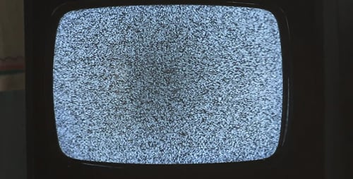 Vintage Television Displaying Static Noise on Screen