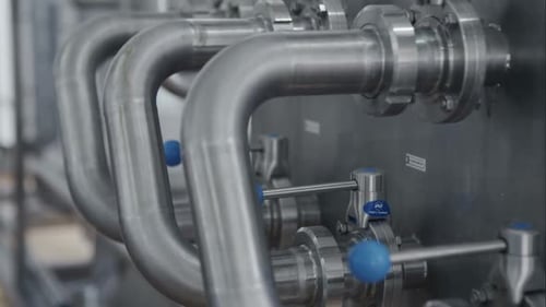Closeup of Pipes and Faucet Valves of Heating System in a Boiler Room of Industrial Pharmacy Factory