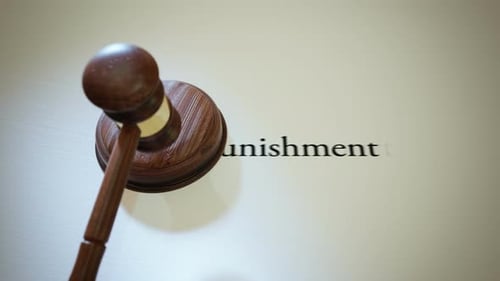 Gavel hitting sound block in a court with a words describing legal profession.