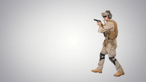 Soldier Aims Firearm Against Plain Background