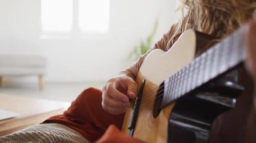 Guitarist Plays Acoustic Guitar at Home