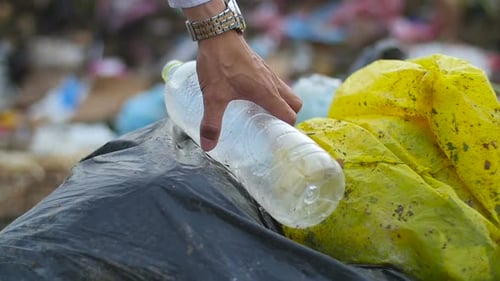 Discarded Plastic Bottle on Waste Pile