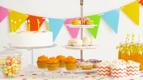 Festive Birthday Party Table with Cake and Sweets
