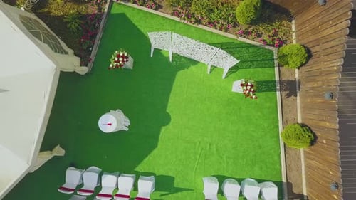 Wedding Venue with Flowers Near Tent in Yard Aerial View