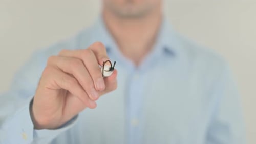 Man Writing Public Affairs on Clear Surface