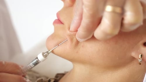 Close Up of Cosmetic Injection Procedure on Woman
