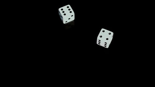 Rolling Dice on Black Background