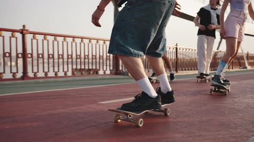 Four Teenagers Demonstrate Complex Tricks on Skateboards