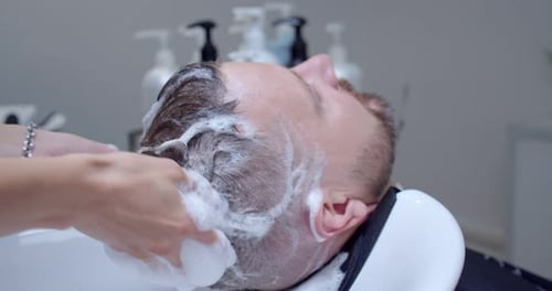 Man Getting a Hair Wash at the Salon