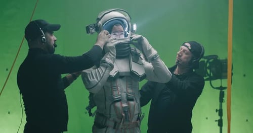 Man in Spacesuit Adjusted on Green Screen