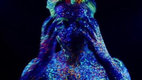 Portrait Abstract Handsome Expressive Man Smeared in Colored Paint Fluorescent and Ultraviolet Light