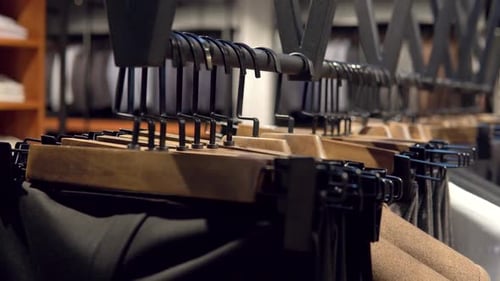 Showcase with Jackets and Pants From the New Collection in the Luxury Boutique of Men's Suits. Men's