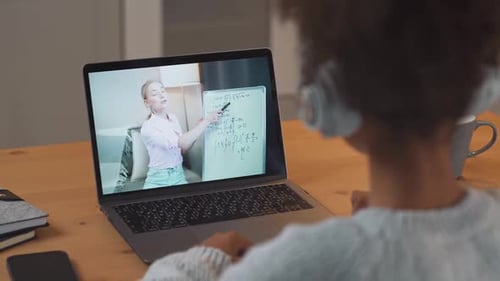 Student Watches Online Math Lesson at Home