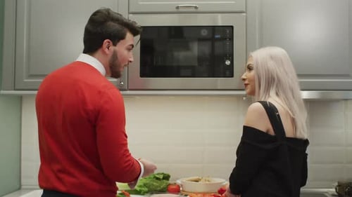 Couple Preparing Food Together in a Modern Kitchen